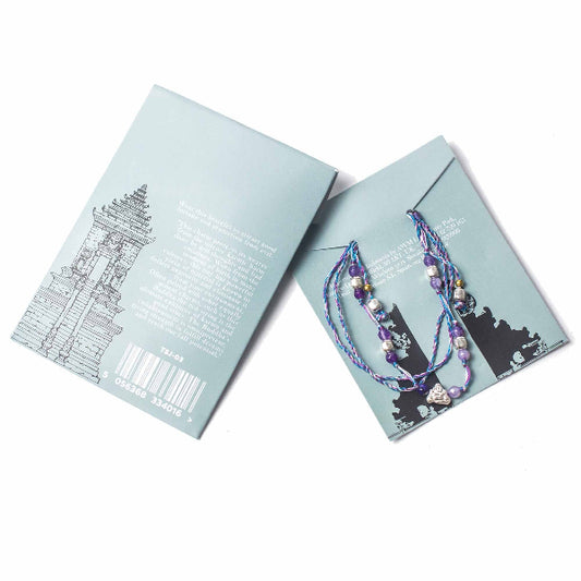 Bracelet displayed on a branded card with a white background