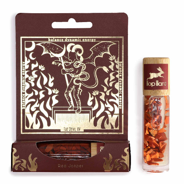 Red Jasper product packaging with decorative design and a tube of Topillare on a white background