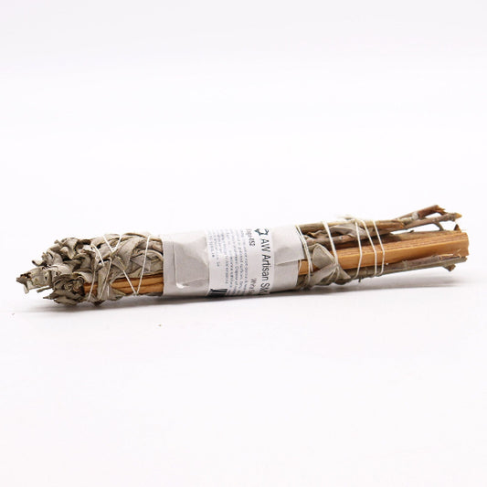Bundled sage sticks with a label on a white background