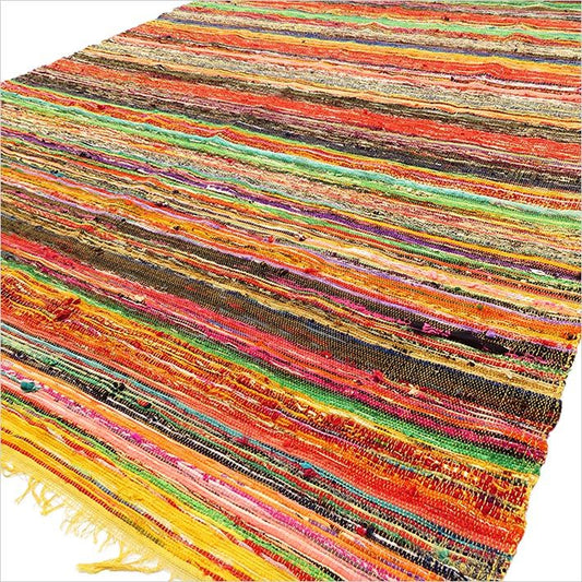 Multicolored striped rug with a fringe on a white background