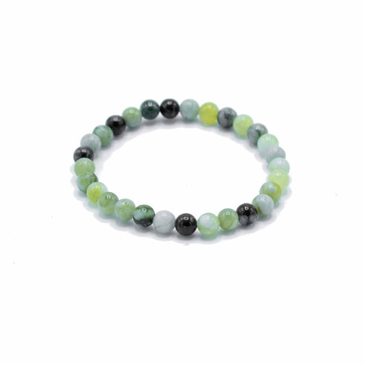 Beaded bracelet with green and black beads on a white background
