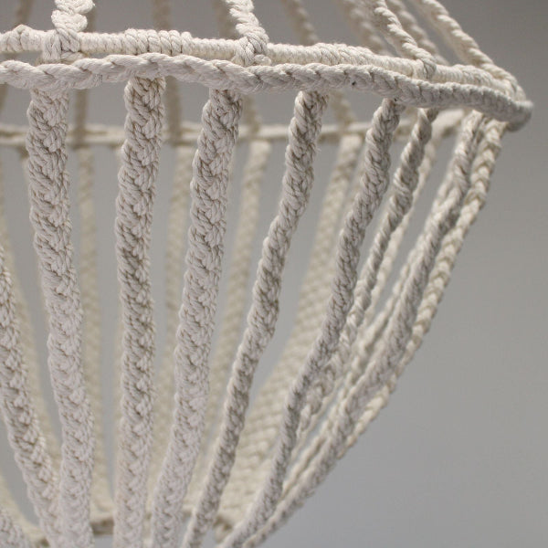 Close-up of a textured rope basket against a neutral background