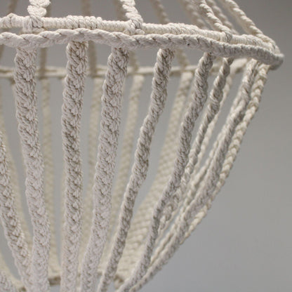 Close-up of a textured rope basket against a neutral background