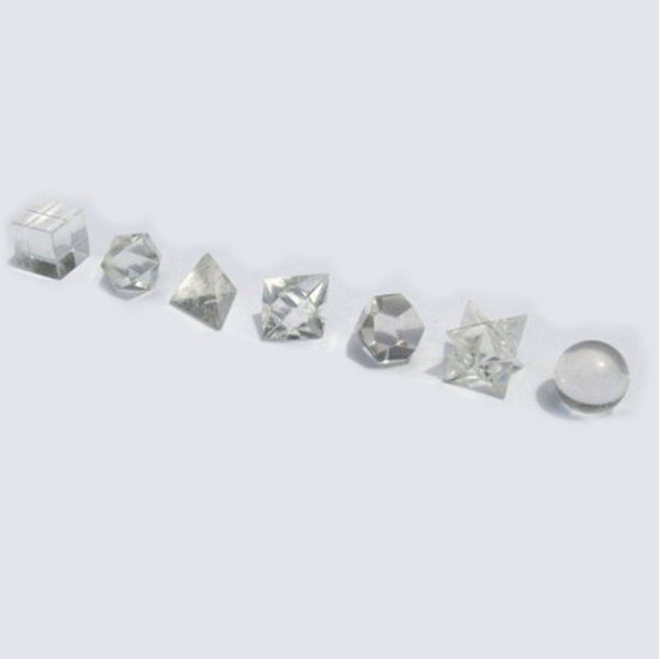 Collection of various crystal shapes on a light gray background
