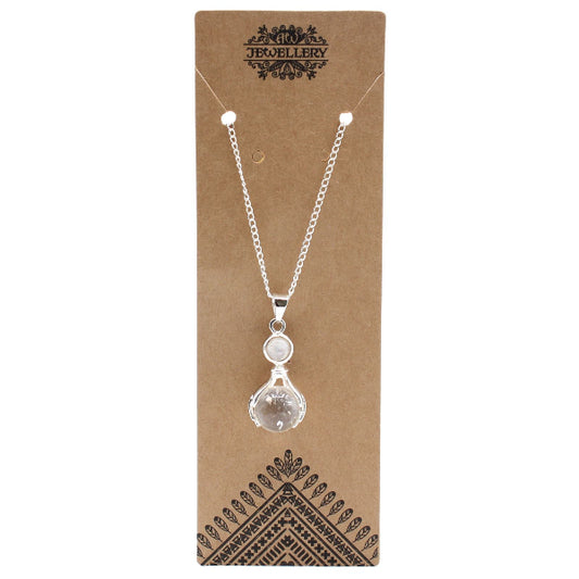 Necklace with a clear pendant on a brown jewelry card