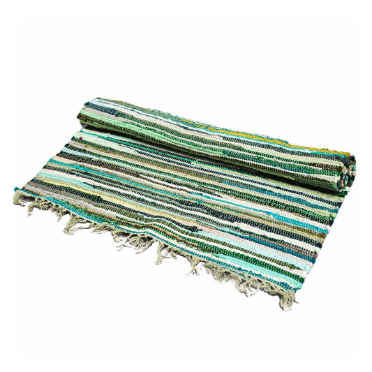 Striped woven mat with fringes on a white background