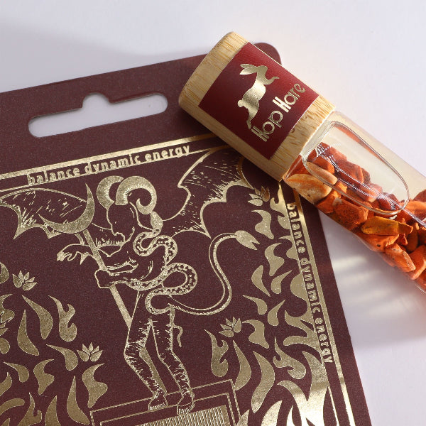 Packaged product with a decorative label featuring a dragon design on a white background