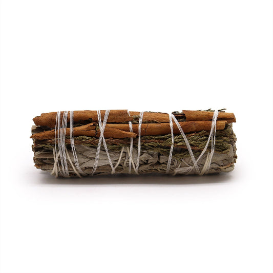 Rolled sage bundle with cinnamon sticks on a white background