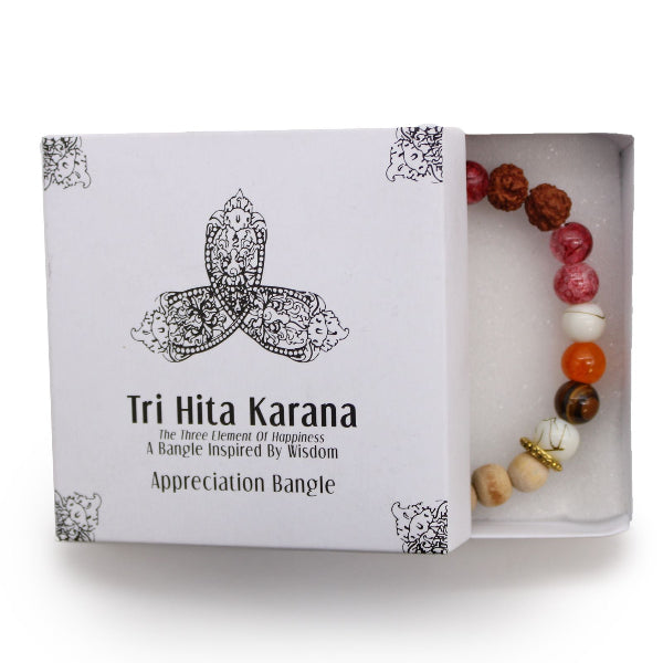 Tri Hita Karana bracelet in a box with a white background