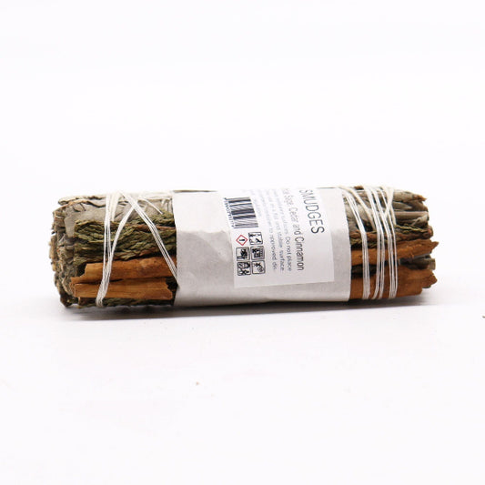 Bundled sage sticks with a label on a white background