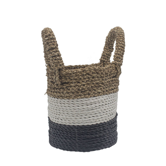Woven basket with two handles in brown, white, and navy on a white background
