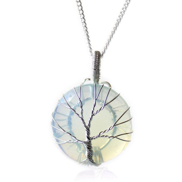 Round pendant with tree design on a white background