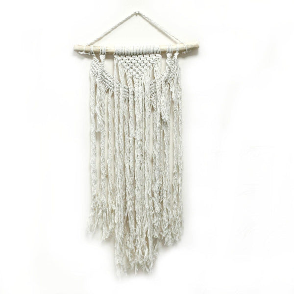 White woven wall hanging on a white background