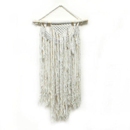 White woven wall hanging on a white background