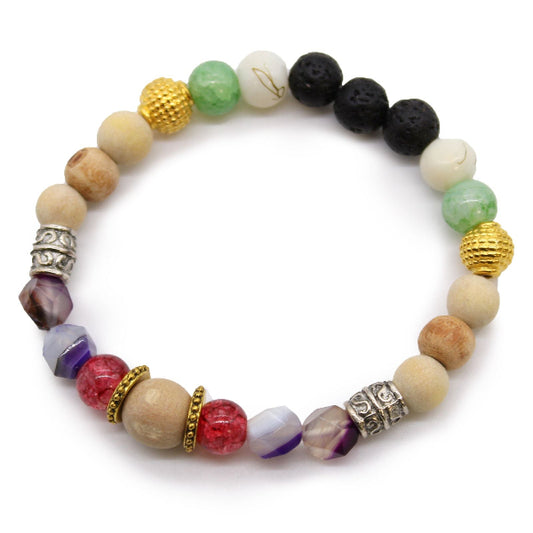 Multicolored beaded bracelet with various textures on a white background