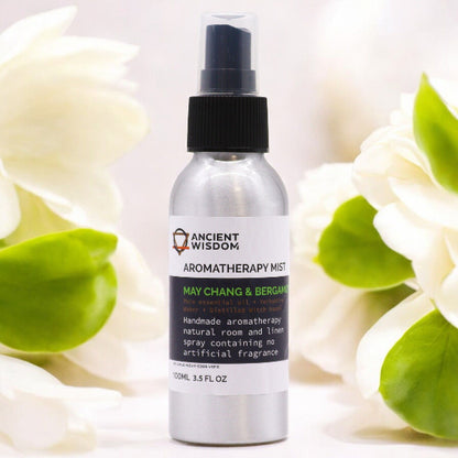 Aromatherapy mist bottle with flowers in the background