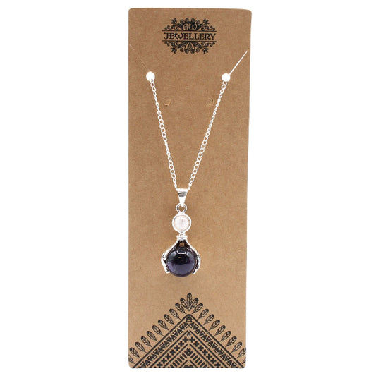 Necklace with a pendant on a brown jewelry card