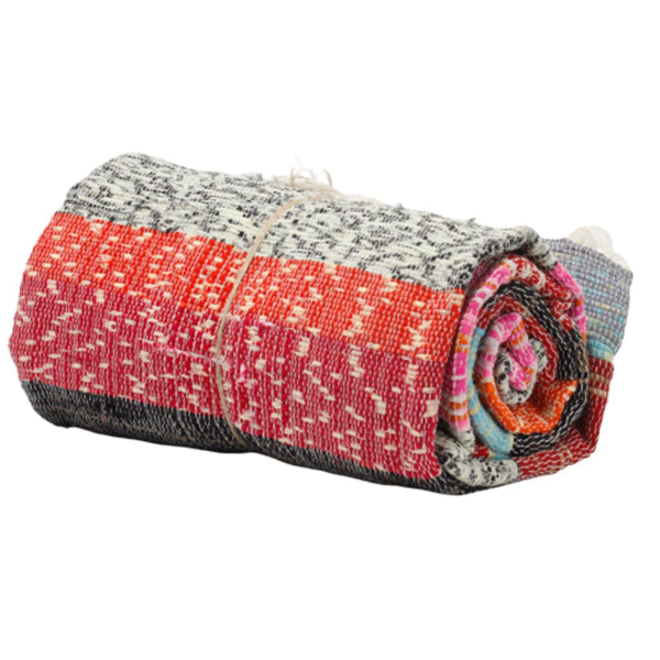 Rolled-up multicolored fabric on a white background