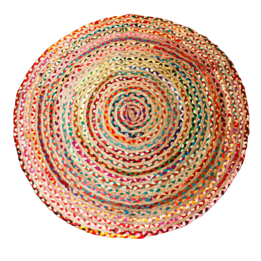 Round multicolored braided rug on a wooden floor