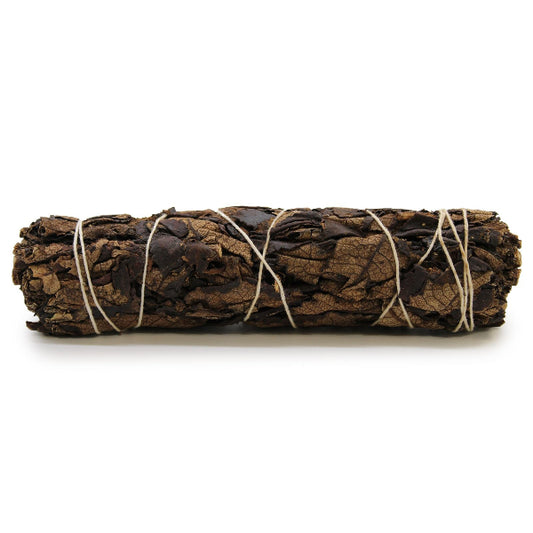 Rolled leaf bundle tied with twine on a white background