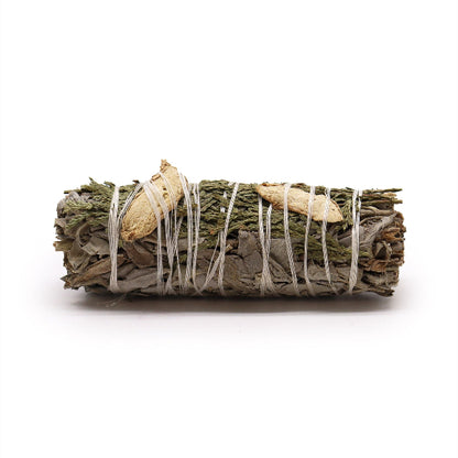 Bundled sage with white string on a white background
