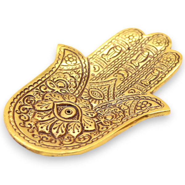 Decorative gold Hamsa hand on a white background