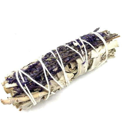 Bundled sage stick with white string on a white background