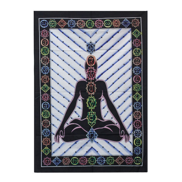 Tapestry with a central figure of a person in a meditative pose, surrounded by colorful chakra symbols on a white background.