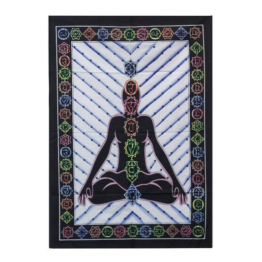 Tapestry with a central figure of a person in a meditative pose, surrounded by colorful chakra symbols on a white background.