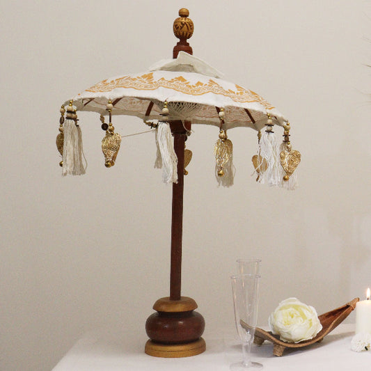 Decorative lamp with intricate design on a plain background