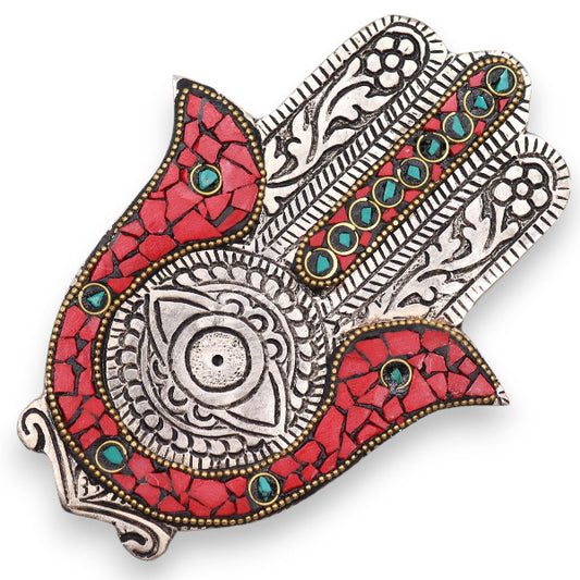 Decorative wall art piece with red, silver, and turquoise patterns on a white background