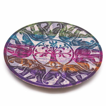 Round colorful coaster with tree of life design on a white background