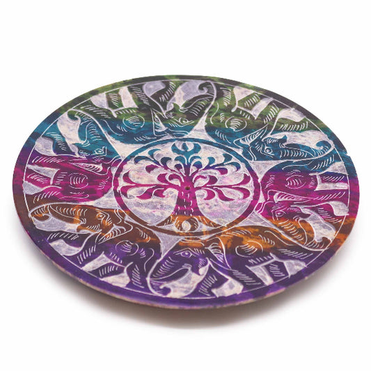 Round colorful coaster with tree of life design on a white background