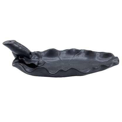Black leaf-shaped garden tool on a white background