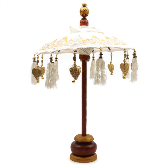 Decorative lamp with tassels and heart-shaped ornaments on a white background