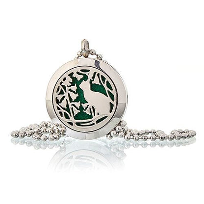 Silver pendant with green design on a white background