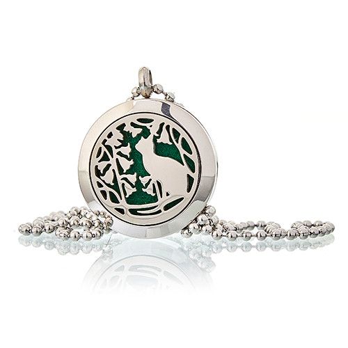 Silver pendant with green design on a white background