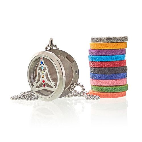 Silver necklace with a circular pendant and colorful bracelets on a white background