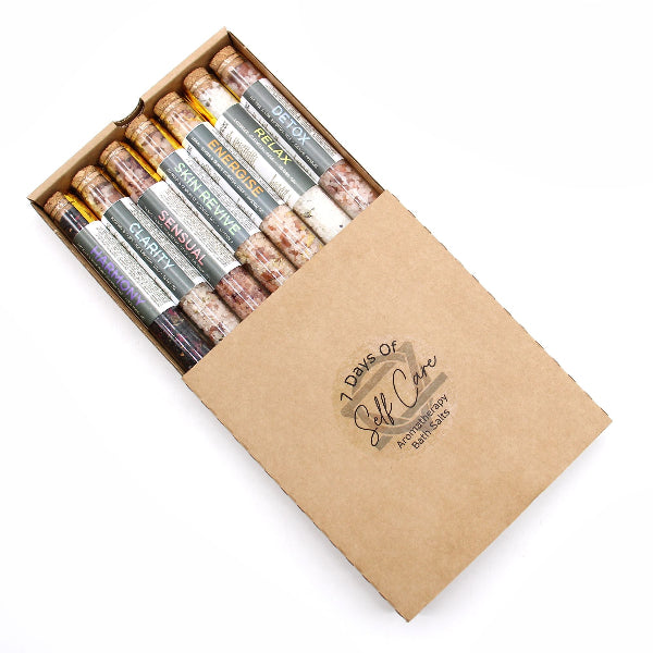 Box of '7 Days of Self-Care' salt sticks with various scents on a white background