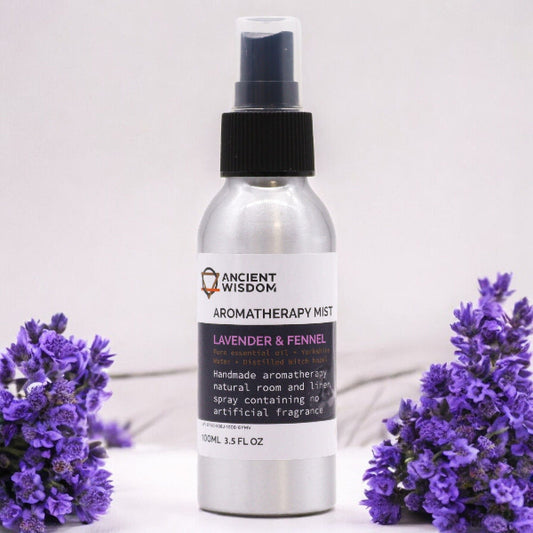 Aromatherapy mist bottle with lavender flowers on a light background