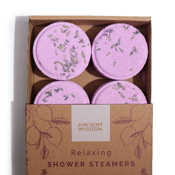 Box of purple shower steamers with 'Ancient Wisdom' branding on a white background