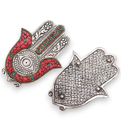 Two decorative animal-shaped pins on a white background