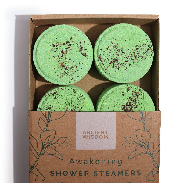 Four green shower steamers in a box labeled 'Ancient Wisdom' on a white background.