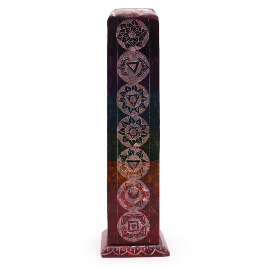 Decorative tower with circular patterns on a white background
