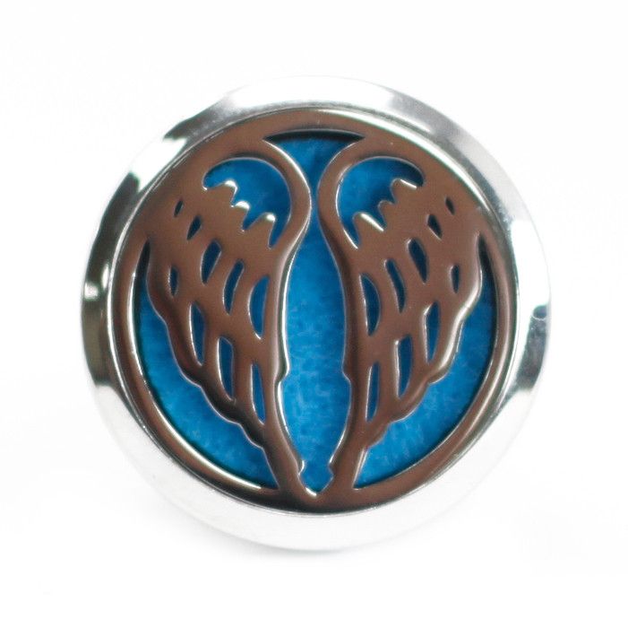Decorative metal emblem with blue center and brown leaf-like patterns on a white background