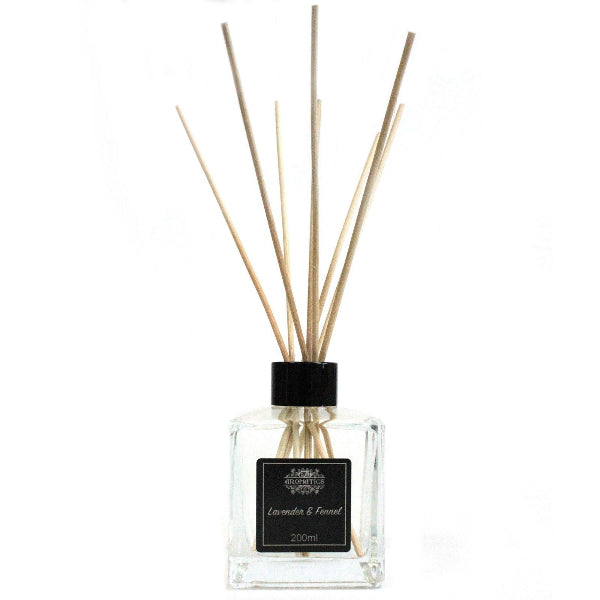 Diffuser bottle with wooden sticks on a white background