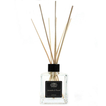 Diffuser bottle with wooden sticks on a white background
