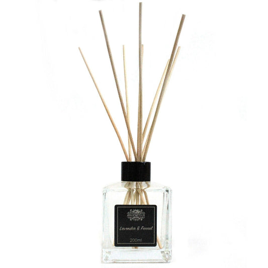 Diffuser bottle with wooden sticks on a white background