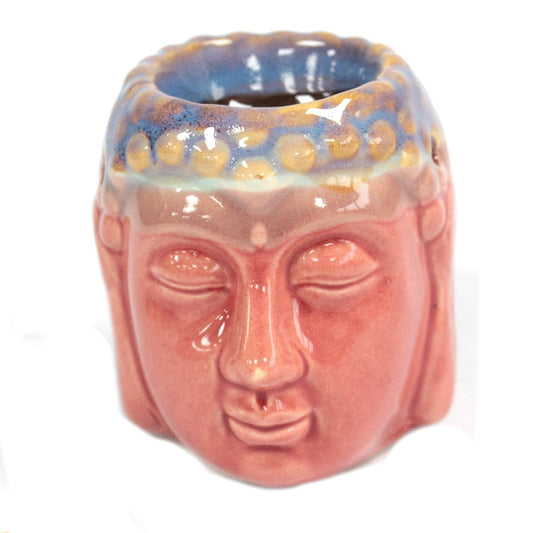 Ceramic face-shaped container with a blue and yellow patterned top on a white background