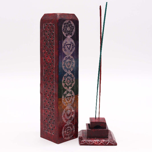 Incense stick holder with chakra design and incense sticks on a white background